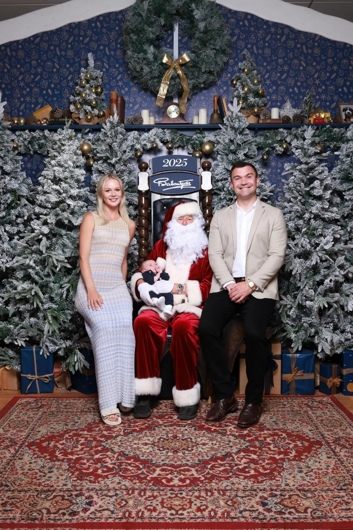 Matthew, Hannah and baby Alexander in a family Christmas photograph